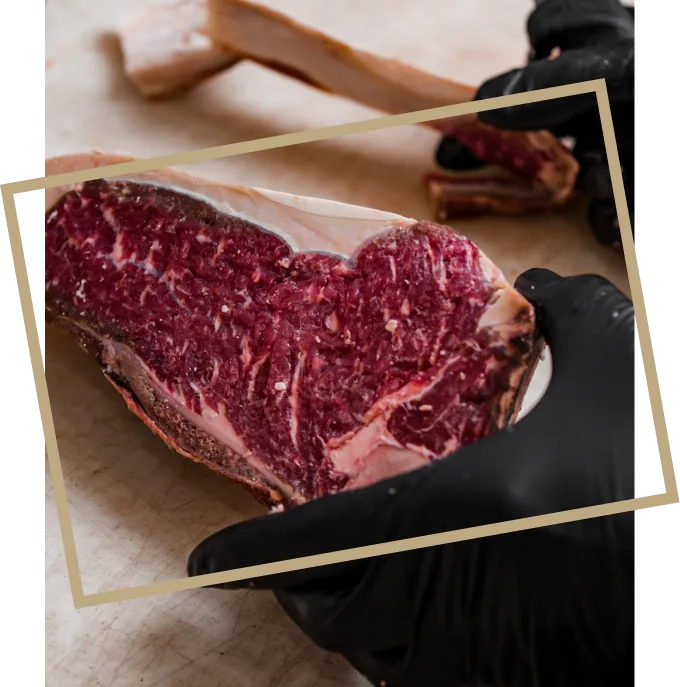 Beef cut being portioned by hand